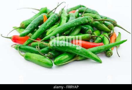 Close up shot of green and red chilis isolated on white background Stock Photo