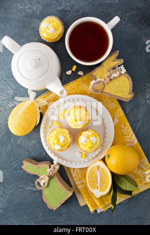 Easter background with lemon cupcakes Stock Photo