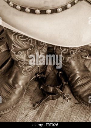 Cowboy spurs, hat and boots Stock Photo