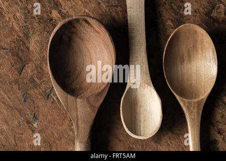 Wooden spoons set on the  stone background Stock Photo