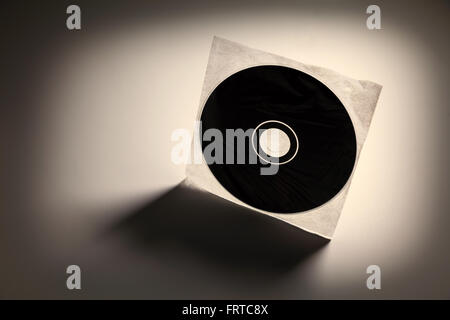 a CD , DVD disk with dark shadow , technology concept Stock Photo - Alamy