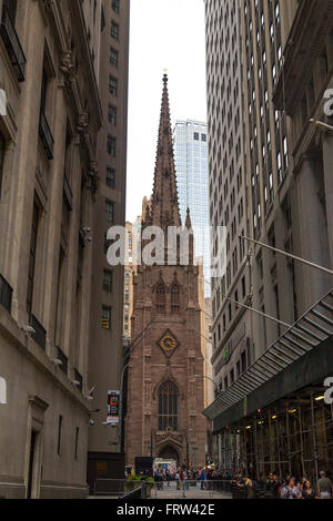 Trinity Church at the intersection of Wall street and Broadway in Manhattan, NYC Stock Photo