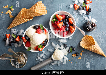 Vanilla ice cream scoops with berries Stock Photo