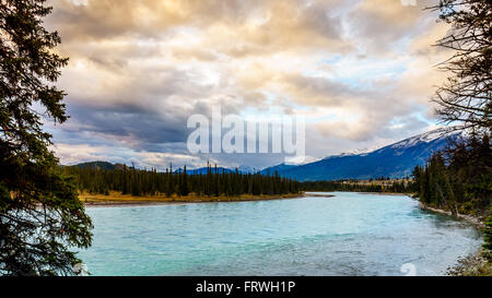 Sunrise over the Athabasca River near the town of Jasper in the Rocky Mountains Stock Photo