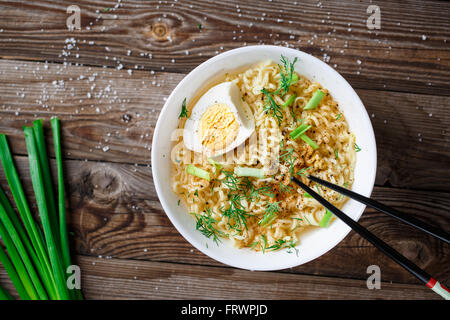 Asian noodles with fresh green onion and boiled egg Stock Photo