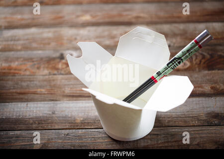 Blank Chinese food container on old wood table Stock Photo