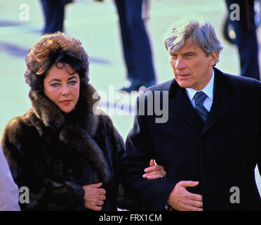 Washington, DC., USA, 20th January, 1981 Elizabeth Taylor and her husband Senator John Warner Republican from  Virginia. seen leaving the swearing in of President Ronald Reagan. Ms. Taylor is wearing a fur coat to combat the cold weather.  Credit: Mark Reinstein Stock Photo