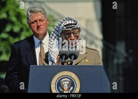 Washington, DC., USA, 13th September, 1993 President William Jefferson Clinton hosts the Palestinian Peace Accords treaty signing on the South Lawn of the White House. Palestine Liberation Organization chairman, Yasser Arafat, delivers his remarks at a public ceremony on the South Lawn of the White House after signing an agreement that granted limited autonomy to Palestine and laid the foundation for future peace talks. President William Clinton listens to Chairman Arafat . Credit: Mark Reinstein Stock Photo