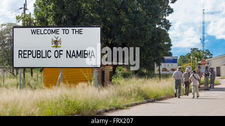 Safari eco-tourists passing the Welcome to Namibia sign at the Muhembo border post with Botswana, southern Africa Stock Photo