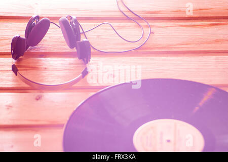 Headphones and vinyl record music background Stock Photo