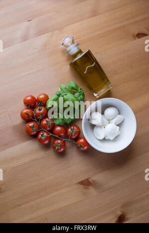 Italy on a plate. Best Italian ingredients: Basil, mozzarella and cherry tomatoes, representing also the colors of Italy's flag. Stock Photo