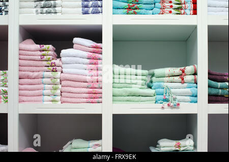 towels bed sheets on the shelf in a store Stock Photo