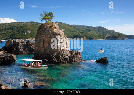 Excursion boats at La Grotta Bay, near Paleokastritsa, Corfu island, Ionian islands, Greece Stock Photo