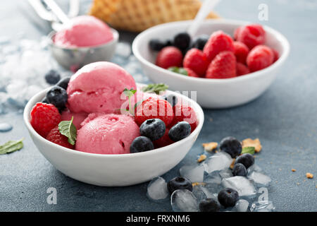 Raspberry ice cream in white bowl Stock Photo