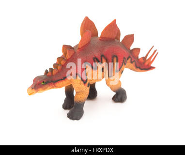 side view red stegosaurus toy on a white background Stock Photo