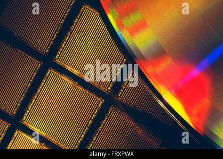 Close-Up Of A Microchip Wafer And A Compact Disk Stock Photo