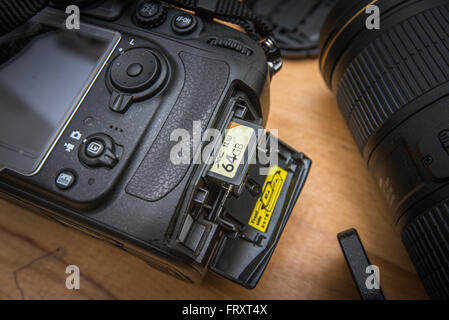 Close up  modern DSLR camera and SD memory card Stock Photo