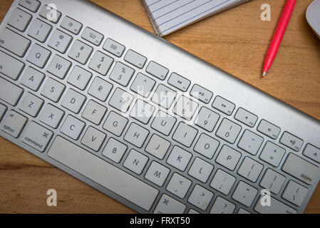 Close up keyboard and office device on wood table Stock Photo