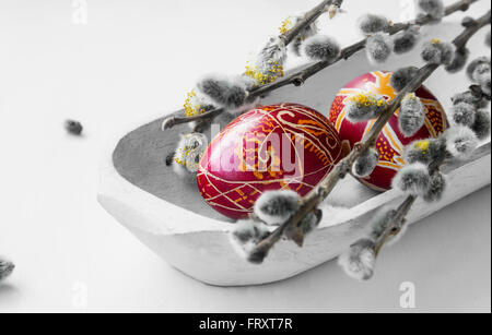 Painted Easter eggs decoration with spring buds branches Stock Photo