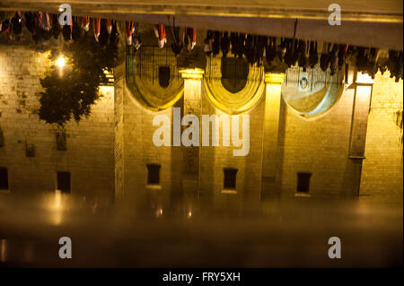 Santander, Spain. 23rd March, 2016.  Reflecting the procession of the holy mercy in a pond Santander during the night of Holy Wednesday  Credit:  JOAQUIN GOMEZ SASTRE/Alamy Live News Stock Photo