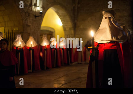 Santander, Spain. 23rd March, 2016.  Nazarenes of the Brotherhood of the Holy funeral procession made the mercy within the cloister of the Cathedral of Santander  Credit:  JOAQUIN GOMEZ SASTRE/Alamy Live News Stock Photo