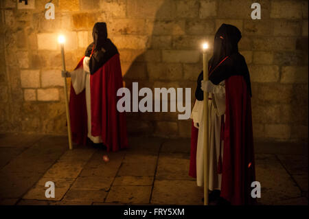 Santander, Spain. 23rd March, 2016.  Two Nazarenes of the Brotherhood of the Holy Burial perform procesionnocturna of mercy in the city of Santander  Credit:  JOAQUIN GOMEZ SASTRE/Alamy Live News Stock Photo