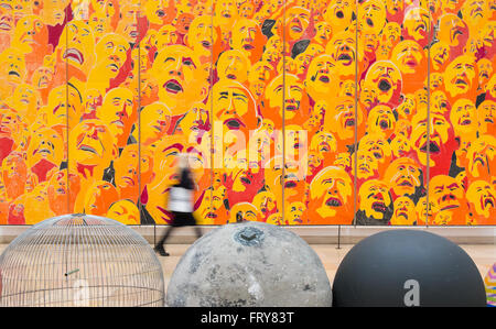Munich, Germany. 24th Mar, 2016. A woman walks past an untitled image by Fang Lijun in the exhibition 'A history: Contemporary art from the Centre Pompidou' at the House of History in Munich, Germany, 24 March 2016. The museum is showcasing 160 works by more than 100 artists from the collection of Centre Pompidou in Paris, France, from 25 March to 04 September 2016. Photo: SVEN HOPPE/dpa/Alamy Live News Stock Photo