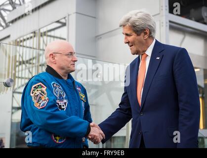 Moscow, Russia. 24th March, 2016.   U.S Secretary of State John Kerry greets NASA astronaut Scott Kelly, left, before a meeting March 24, 2016 in Moscow, Russia. Kerry took a break from meetings on Syria to join the Scott Kelly and Mikhail Kornienko to discuss their record year-long stay aboard the International Space Station. Stock Photo