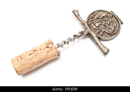 Antique corkscrew with cork isolated on white Stock Photo