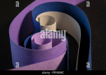 Colourful strips of cardboard as texture and background on black background Stock Photo