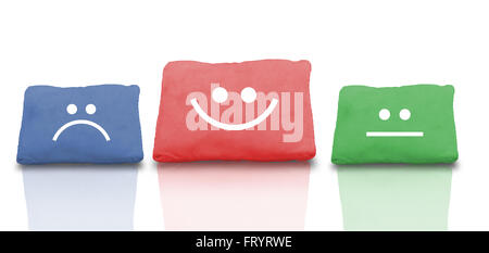 Colourful Collage of pillows with smiley face and reflection. Stock Photo