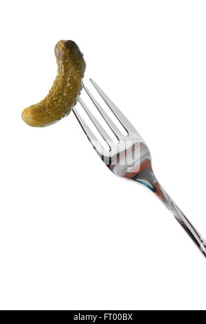 Small pickled cucumber on fork. Isolated on white with clipping path Stock Photo