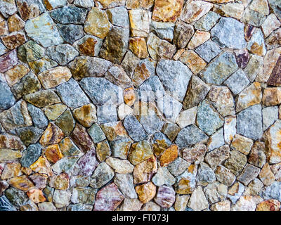granite stone wall a very hard type of rock that is used in buildings and monuments Stock Photo