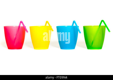 Plastic picnic glasses with drinking straws in different colors isolated on white background Stock Photo