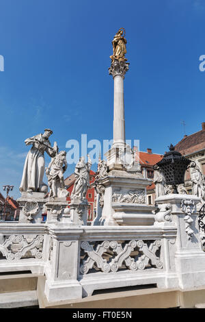 Plague Column with Holy Virgin Mary and apostols statues situated in the Main Square of Maribor, the second largest city of Slov Stock Photo