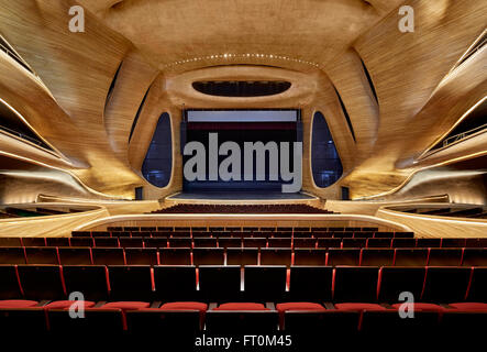 Multi-storey grand theatre interior with timber sculpted walls. Harbin Opera House, Harbin, China. Architect: MAD Architects, 20 Stock Photo