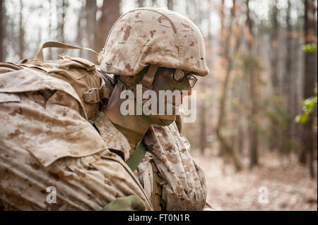 Candidates assigned to Delta Company, Officer Candidates Class-221, are evaluated as members of a fire team during the Small Unit Leadership Evaluation 1 at Brown Field, Marine Corps Base Quantico, Va., Feb. 22, 2016. The mission of Officer Candidates School (OCS) is to 'educate and train officer candidates in Marine Corps knowledge and skills within a controlled, challenging, and chaotic environment in order to evaluate and screen individuals for the leadership, moral, mental, and physical qualities required for commissioning as a Marine Corps officer.' (U.S. Marine Corps Photo by Cpl. Patric Stock Photo