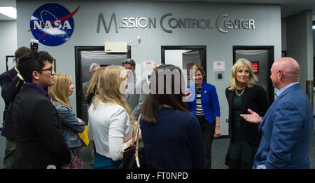 Dr. Jill Biden, wife of U.S. Vice President Joe Biden, second from right, is seen in the Johnson Space Center's Mission Control Center with Ellen Ochoa, director, NASA's Johnson Space Center, third from left, and former astronaut Mark Kelly, right, Wednesday, March 2, 2016 at NASA's Johnson Space Center in Houston, Texas.  Dr. Biden traveled to Houston to welcome home astronaut Scott Kelly, who is returning to Houston after a year long mission aboard the International Space Station.