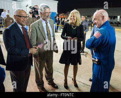 Expedition 46 Commander Scott Kelly of NASA, right, is seen with NASA Administrator Charles Bolden, left, Dr. John Holdren, director of the White House Office of Science and Technology Policy, second from left, and Dr. Jill Biden, wife of Vice President Joe Biden, second from right, after returning to Ellington Field, Thursday, March 3, 2016 in Houston, Texas after his return to Earth. Kelly and Flight Engineers Mikhail Kornienko and Sergey Volkov of Roscosmos landed in their Soyuz TMA-18M capsule in Kazakhstan on March 1 (Eastern time). Kelly and Kornienko completed an International Space Sta
