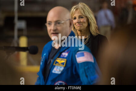 Dr. Jill Biden, wife of Vice President Joe Biden, is seen as Expedition 46 Commander Scott Kelly of NASA delivers remarks at Ellington Field, Thursday, March 3, 2016 in Houston, Texas after his return to Earth. Kelly and Flight Engineers Mikhail Kornienko and Sergey Volkov of Roscosmos landed in their Soyuz TMA-18M capsule in Kazakhstan on March 1 (Eastern time). Kelly and Kornienko completed an International Space Station record year-long mission as members of Expeditions 43, 44, 45, and 46 to collect valuable data on the effect of long duration weightlessness on the human body that will be u Stock Photo