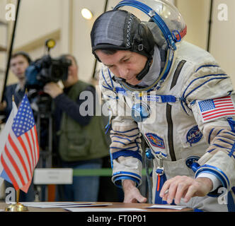 Expedition 47 backup crew member, NASA astronaut Shane Kimbrough signs documents ahead of his Soyuz qualification exams with Russian cosmonauts Andre Borisenko and Sergei Ryzhikov of Roscosmos, Wednesday, Feb. 24, 2016, at the Gagarin Cosmonaut Training Center (GCTC) in Star City, Russia. Stock Photo