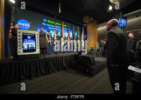 Renee Barnes, soloist, and the Military District of Washington open NASA's Black History Month program as NASA Administrator Charles Bolden watches from the audience on Wednesday, February 24, 2016 at NASA Headquarters in Washington, DC. During the program, Dr. George Carruthers and Dr. Katherine Johnson were honored for their contributions to NASA. Stock Photo
