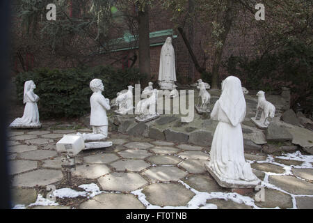 Shrine to 'Our Lady of Fatima Apparition' the 1917 sighting by 3 children in Portugal of the Virgin Mary who spoke to them every week for a month as the story goes.  Catholic Church, Brooklyn, New York. Stock Photo
