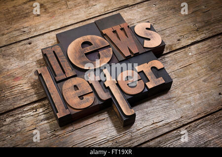 Newsletter, word written with vintage letterpress printing blocks on rustic wooden background, angled view Stock Photo