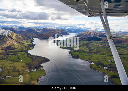 An aerial view of Ullswater in the Lake District with snow capped mountains, North West England, UK Stock Photo