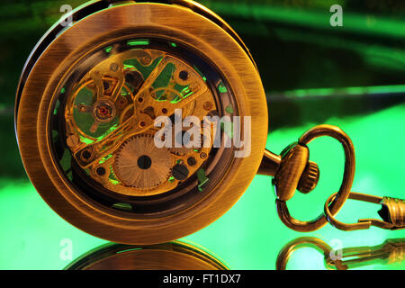 The inner gears of a pocket watch. Stock Photo