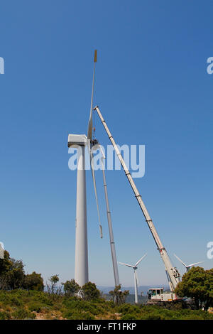 Wind turbine being repaired, assisted by crane and elevator Stock Photo