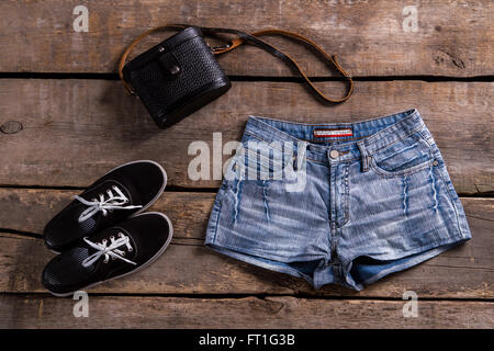 Woman's denim shorts with handbag. Stock Photo