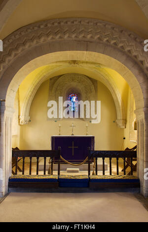 Altar and Stained Glass window interior of St John the Evangelist Church, Elkstone, Gloucestershire, Cotswolds, England Stock Photo