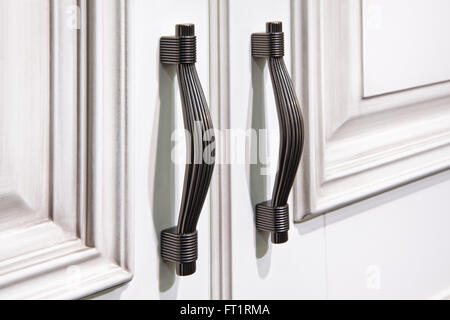 silver handles on cabinet doors Stock Photo